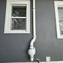 Radon pipe on stucco home